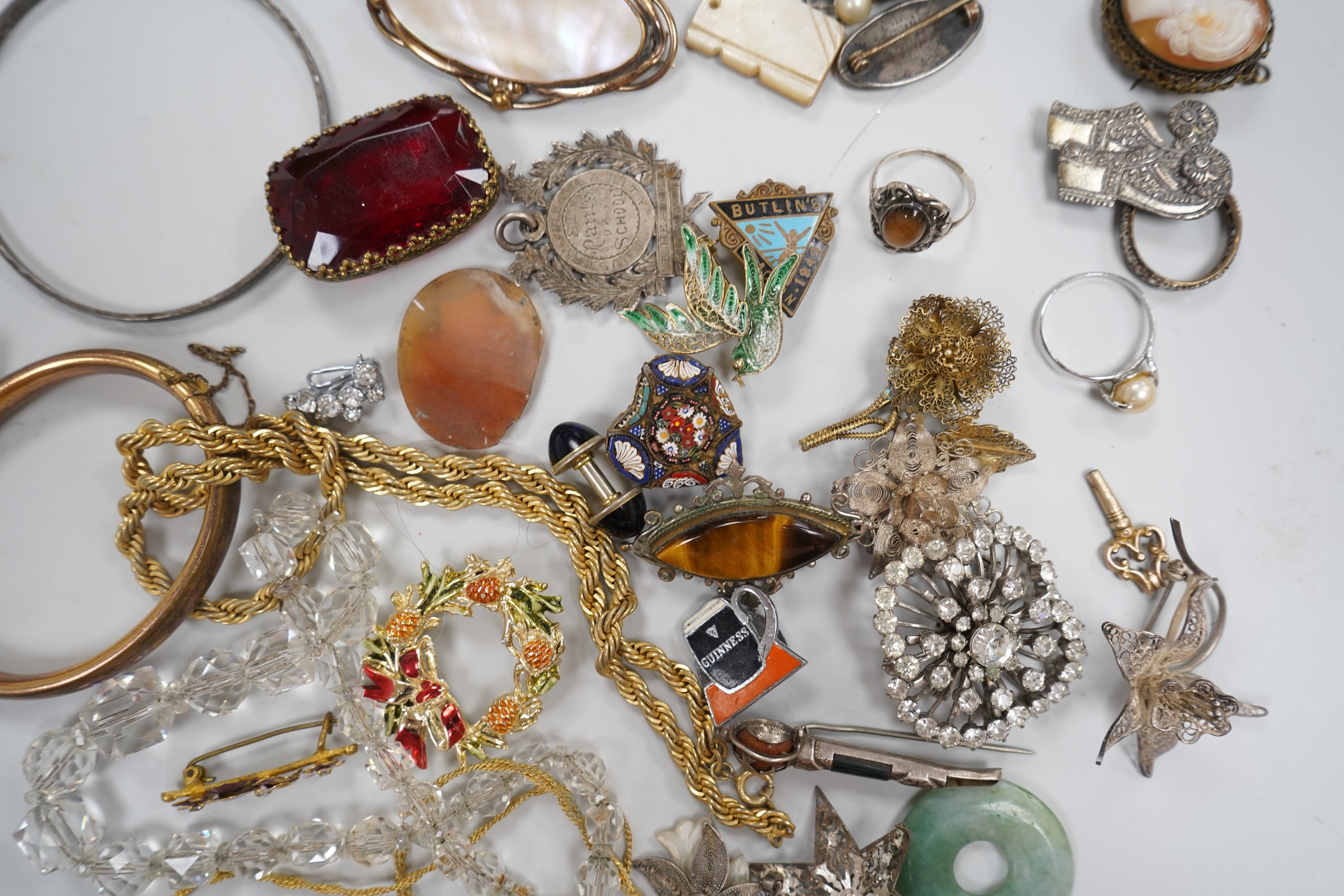 A group of costume jewellery and collector's items in a Japanese lacquer box